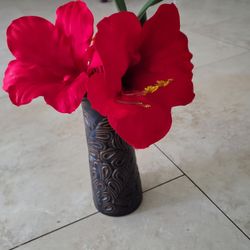 Red Flowers In Brown Vase