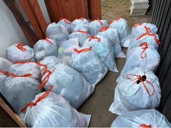 Big plastic bag, full of clothes