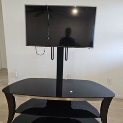 Tv ( SAMSUNG) with TV STAND .