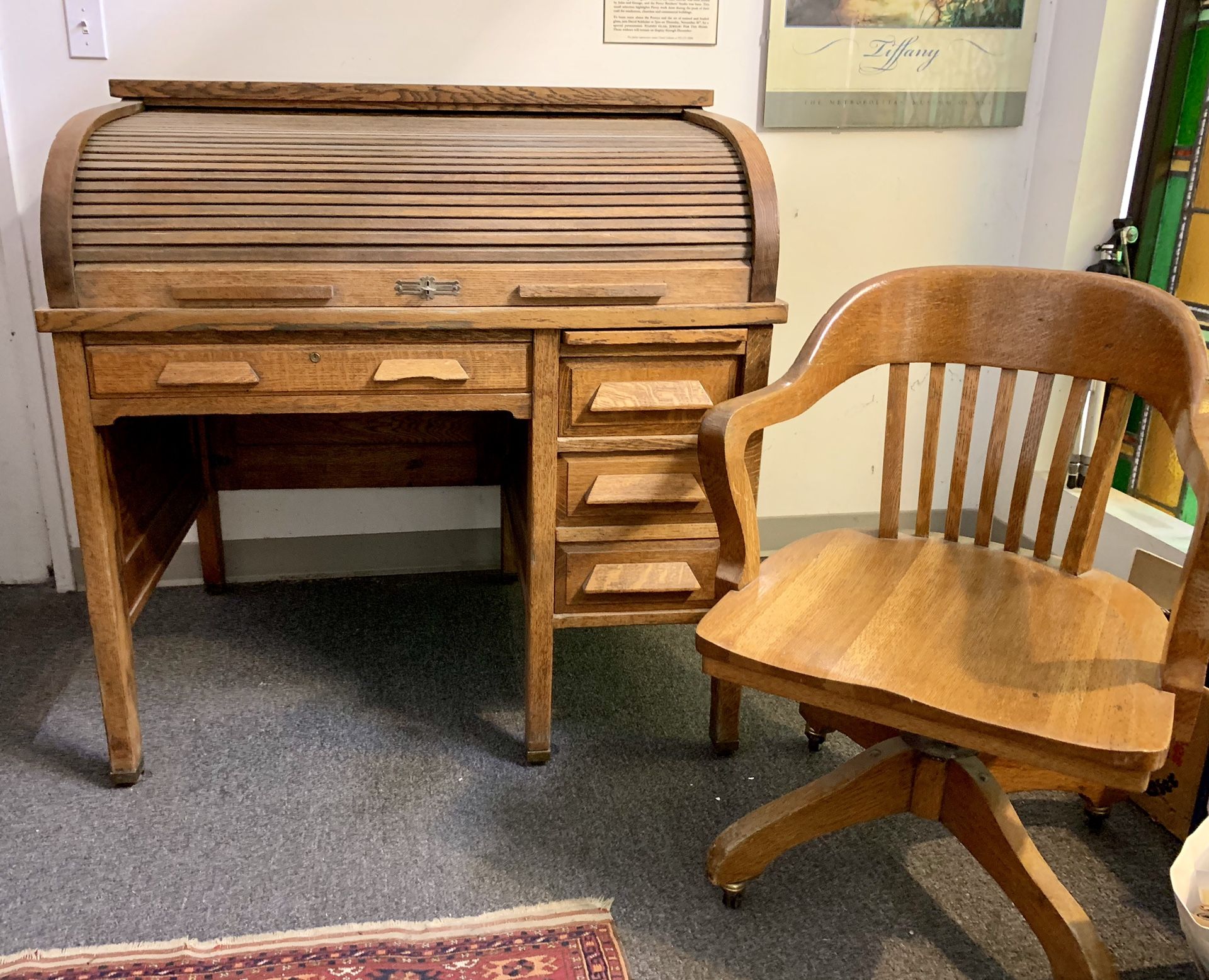 Antique roll top desk and oak swivel chair