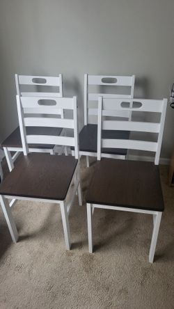Four brand new wooden chairs