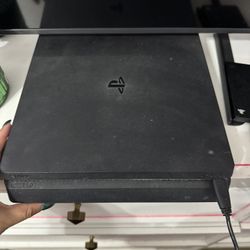 ps4 with lots of games headset charging set and controllers