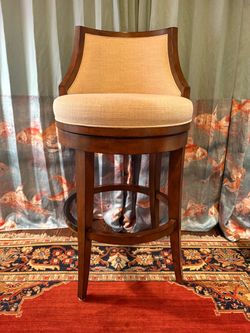 Tommy Bahana Upholstered Swivel Bar Stool with Wood Frame