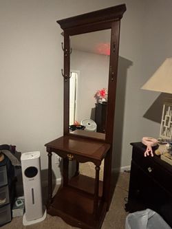 vintage/antique-style wooden console table with attached mirror