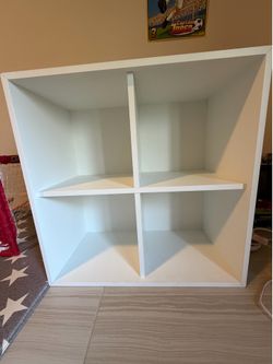 Like new - white 4 square section storage.