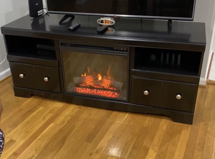 Tv Stand with fire place.