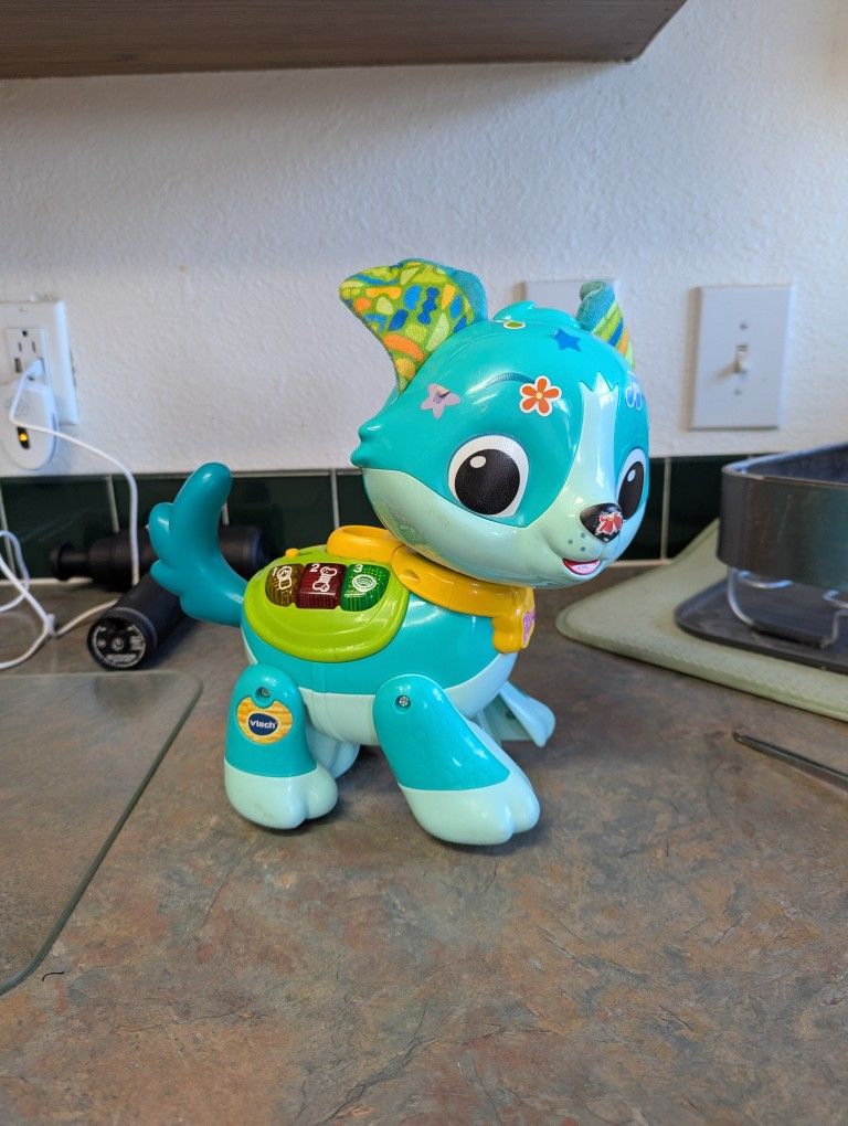 VTech Let's Go Rescue Pup
This pup does work. The only thing missing from it is the leash that's supposed to go with it 
This pup is about 10 in long 