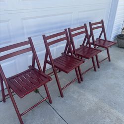 Four Red Wood Folding Chairs
