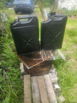 Two vintage military 5 gal fuel cans