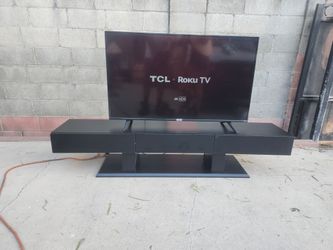 44" TCL Roku TV with Black TV Stand (can be sold separately)