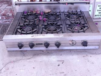 Viking 6 burner cook top with vent and electric start hood included and Thermador double oven