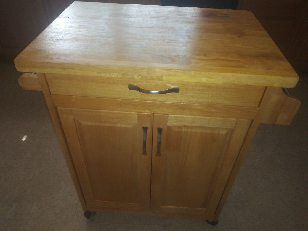 Kitchen island with towel rack, condiment holder, cabinet and drawer