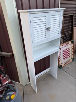 IKEA Bathroom shelf unit. Made for going behind a toilet but I guess you could use it for whatever, it is in 2 parts so you could use just the top if 