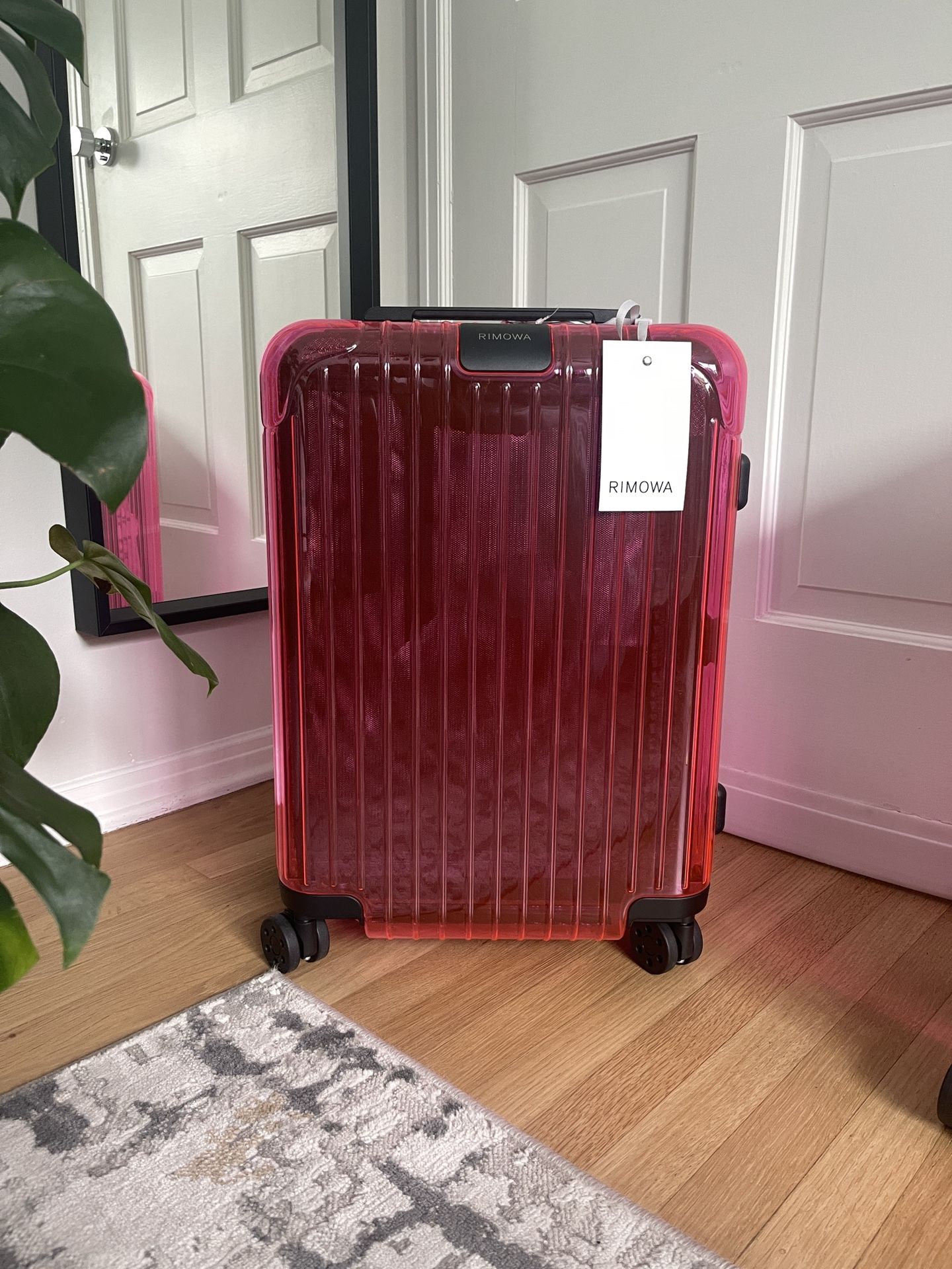 Rimowa Essential Neon transparent pink suitcase