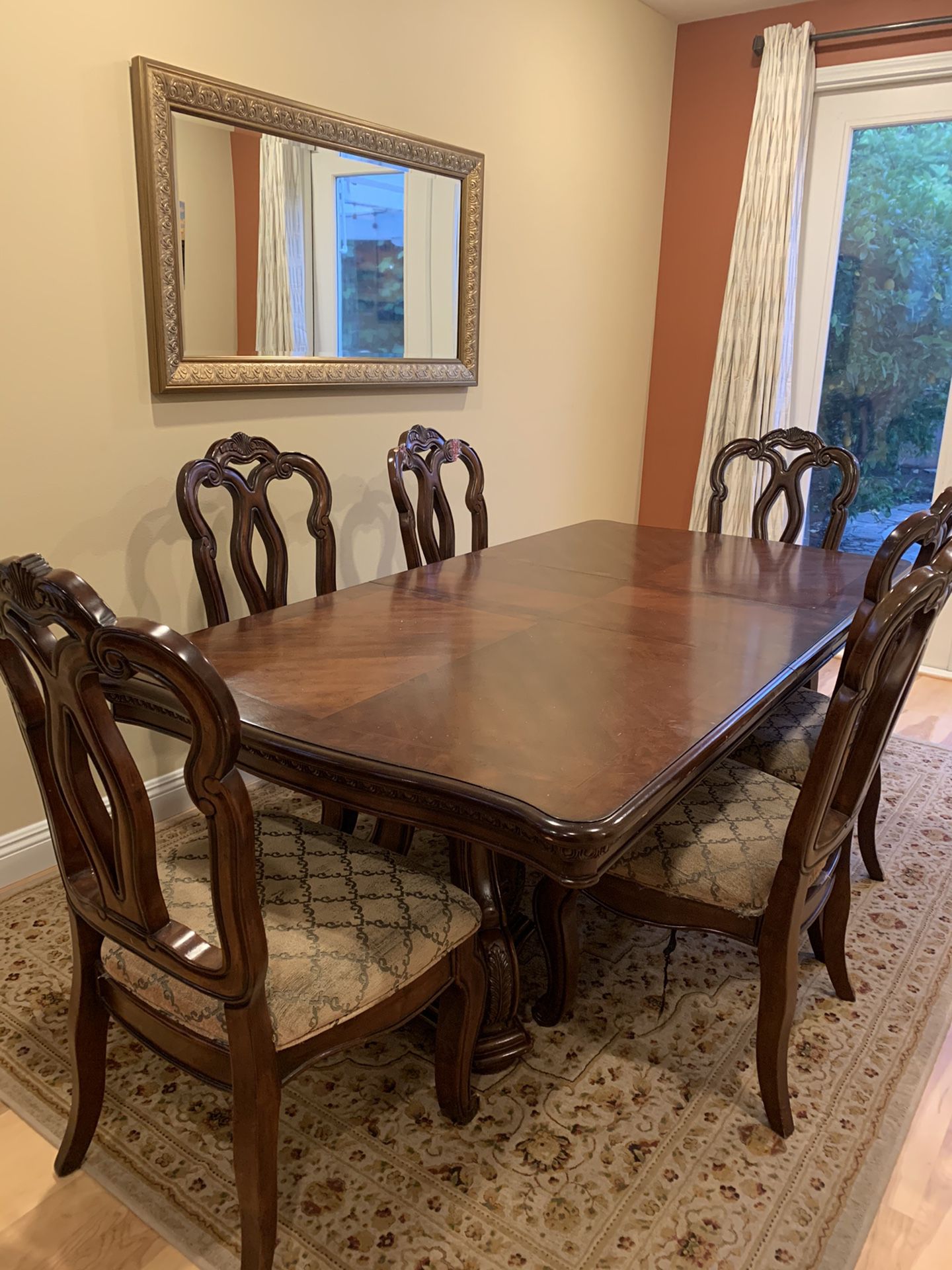 Formal dining table with 4 chairs plus area rug