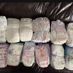 New Diapers And Training Pants, Size 5-6, around 70-80 total $25 for all