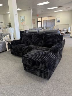 Reclining sectional with storage chaise