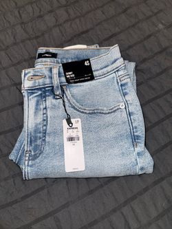 Mid Rise Light Wash Ripped Hyper Sculpt Skinny Jeans