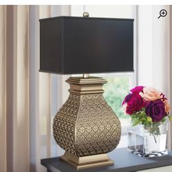 {ONE} Cutright 29” table lamp. Base material: resin. Overall: 29” H x 11” W x 16” D. Base color: metallic. MSRP: $252. Our price: $88 + Sales tax 