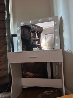 Beautiful white vanity with movie star lighting