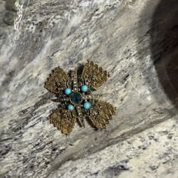 This vintage brooch appears to be a Maltese cross style piece, often associated with designers like Sphinx or ART (Arthur Pepper) from the mid-century