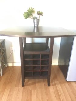 Table with folding sides plus 2 stools