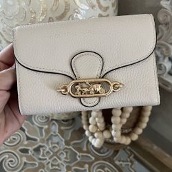 Coach Jade Medium Envelope Wallet in the color Chalk/Cream with gold-tone hardware. 