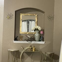 Mirror with a troller with two table gold