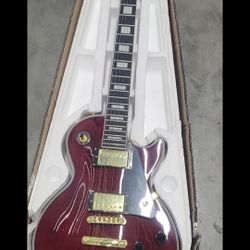 Les Paul Custom electric guitar in a wine red finish with gold hardware,