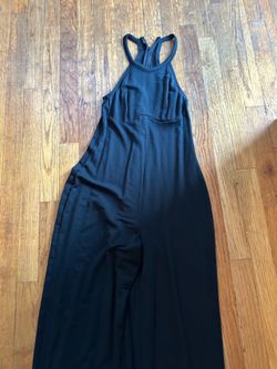 Yitty black jumpsuit with zipper detail and wide leg design. Size: XS