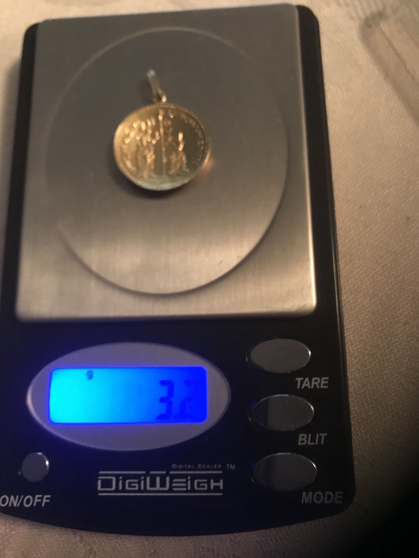 A beautiful religious coin gold 3.2 grams