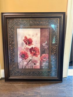 Red poppies in frame