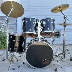 Black drum set with cymbals and hardware