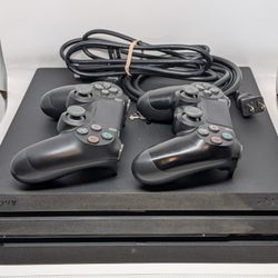 Sony PlayStation 4 Pro + 2 DualShock 4 Controllers – Great Condition