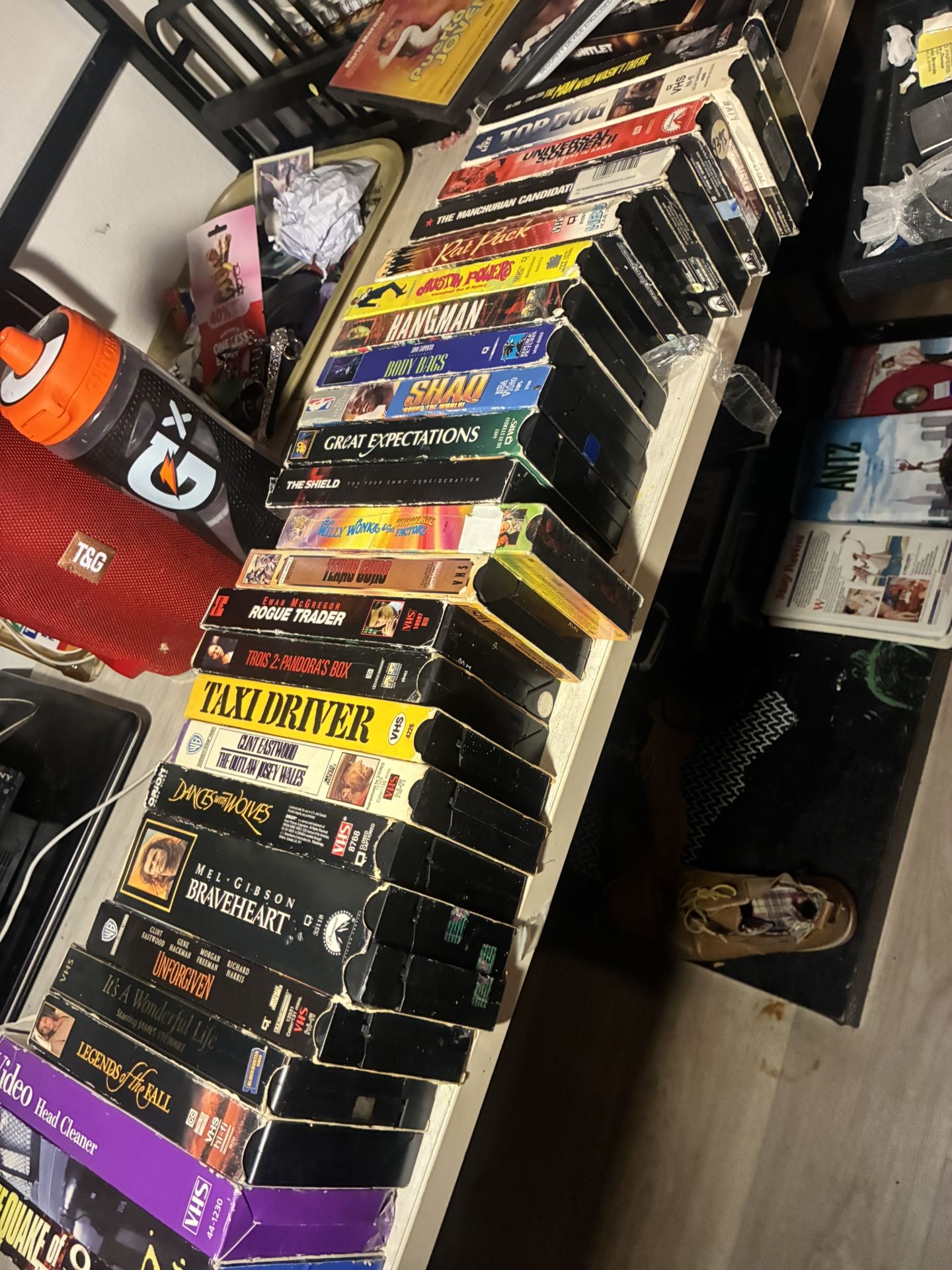 Bundle of VHS tapes, including Taxi Driver, Shoah, and The Shield vhs movies vintage VHS, movie collection, film reel, retro home video, cinematic
