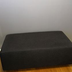 Dark gray ottoman, modern entry seat, bench by Steelcase 