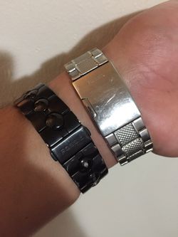 Two fossil watches silver one works fine black one needs battery