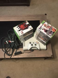 X Box 360/ 60 GB with 1 controller and wireless adapter , plus 25 games