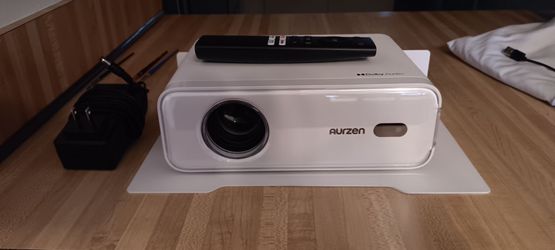 Aurzen EAZZE D1 Smart Projector (Model D001) in excellent condition with the matching white metal wall mount/shelf.