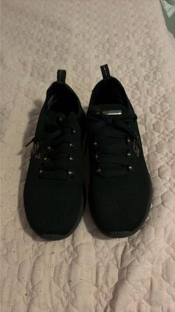 Black and gold sneakers