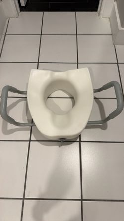 Raised toilet seat