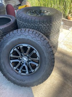 17” FORD RAPTOR WHEELS WITH BFG TIRES.