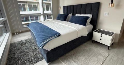Dark Gray Upholstered Bed Frame with Tall Headboard