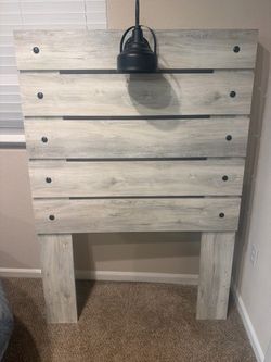 Twin wooden headboard with light fixture