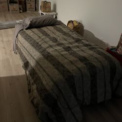 New twin mattress, bed frame, and vintage bedding