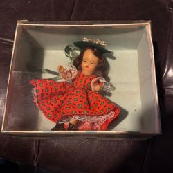 Storybook Doll Red Dress With Green Dots On It