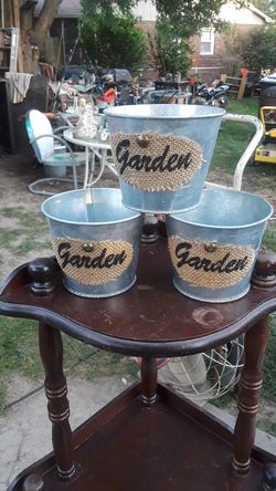 Three little galvanized flower pots