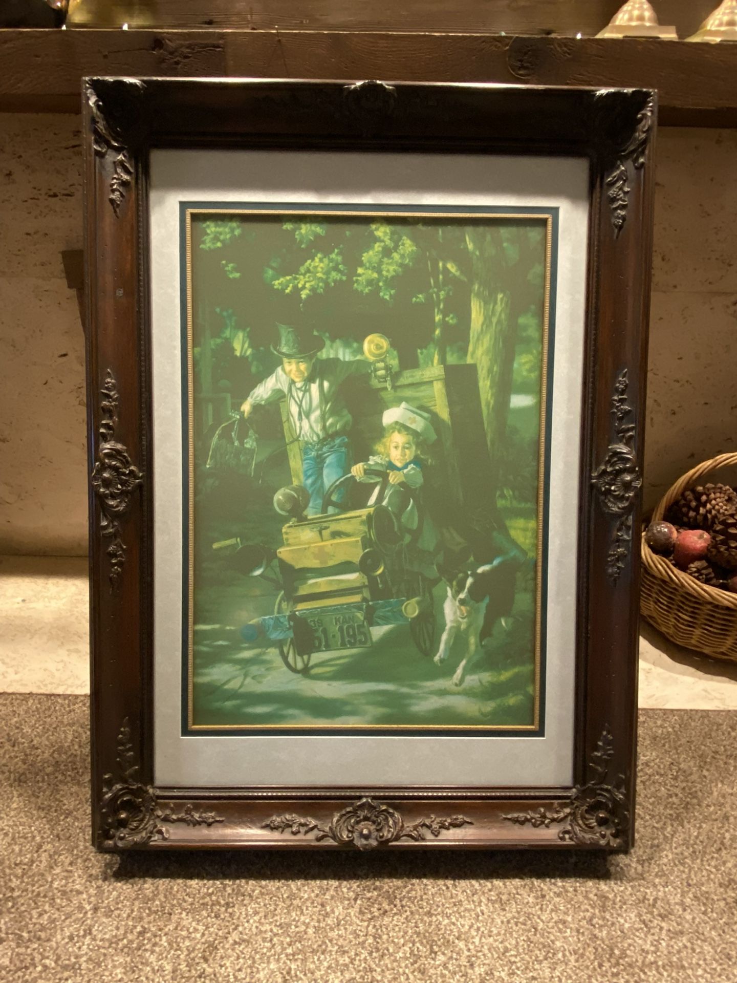 Kids in cart with dog painting