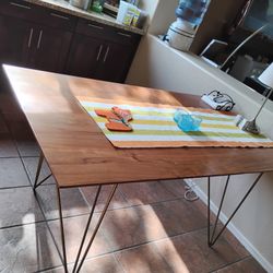 Cherry  dining table with hair pin legs.
