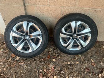 2 tires with Honda hubcaps